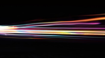 Colorful light streaks against a dark background, creating a dramatic display of motion and energy in a long-exposure photograph.