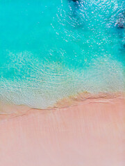 Gorgeous aerial perspective of a tropical beach showcasing a mix of powdery white sand and clear turquoise water