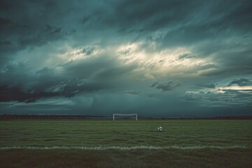 Dramatic Stormy Sky Above a Lonely Football Field with Abandoned Soccer Ball - Sports Print and Poster Design