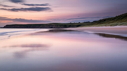 Obraz premium Serene Sunset Over a Coastal Beach