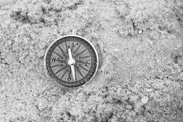 Classic navigation compass on natural background