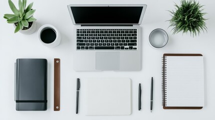 Minimalist Workspace with Laptop, Notebooks and Pens.