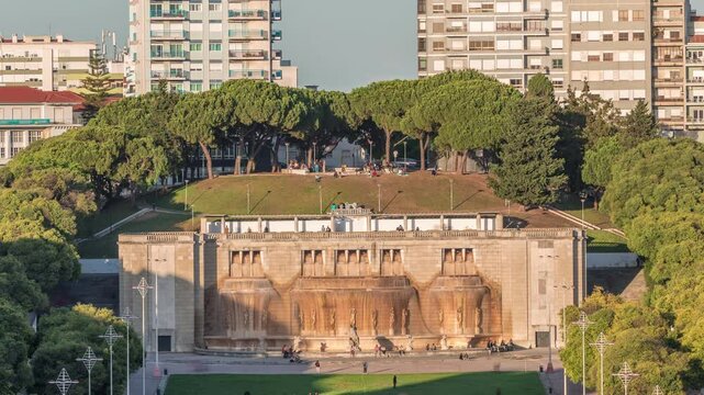Fonte Luminosa fountain aerial timelapse. Alameda public park in the city center. Residential buildings. It was built to celebrate regular water supply to the eastern part of Lisbon. Portugal.