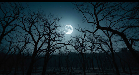 Eerie full moon over barren trees background