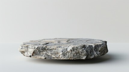 Empty stone pedestal with rough texture on white background for product display mockup.