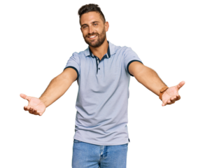 Handsome man with beard wearing casual clothes smiling cheerful offering hands giving assistance and acceptance.