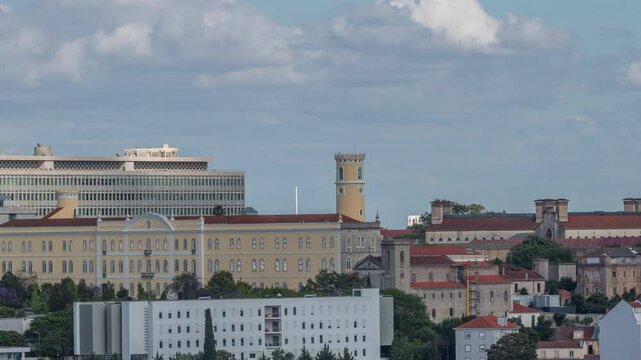Aerial timelapse panorama of Lisbon city center with old prison (Estabelecimento Prisional de Lisboa), Colegio Almada Negreiros and Palacio da Justica. Located near Eduardo VII park. Portugal