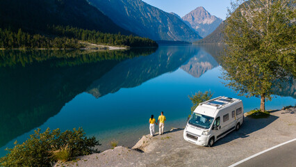 Exploring the serene beauty of Plansee Austria in a camper van by the crystal-clear waters