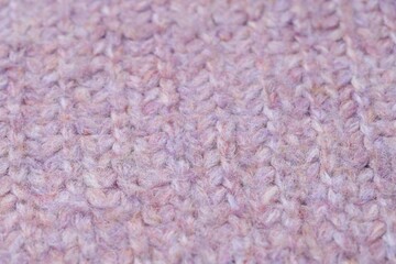 Texture of bright knitted fabric as background, closeup