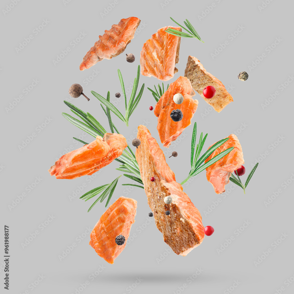 Canvas Prints delicious grilled salmon, rosemary and mix of peppers falling on grey background