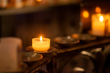 Warm glow of candlelight illuminates tranquil evening scene