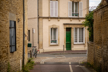 Fototapeta premium Charming european village street with bicycle and historic architecture
