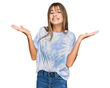 Teenager caucasian girl wearing casual clothes celebrating victory with happy smile and winner expression with raised hands