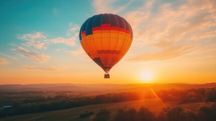 Fototapeta premium A hot air balloon rising into the sky at sunrise, with bright lens flare effects adding warmth and drama to the shot
