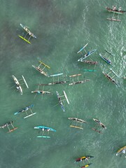 Stunning aerial view of Mirissa, Sri Lanka: a tropical paradise with palm-fringed beaches, vibrant blue waters, and picturesque coastline under clear, sunny skies.