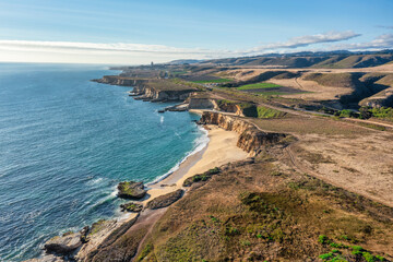 Beautiful landscape along Highway 1 in California. Pacific Ocean coastline along the bay, aerial view. Travel and vacation concept.