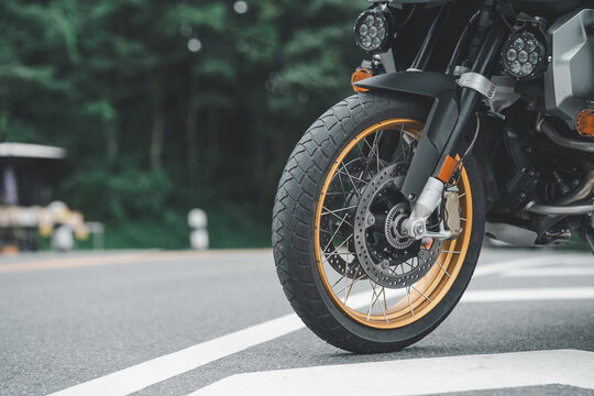 Part of a touring bike Driver's bike. Parking on the street during the day with good light. And there is space to copy space for text.  Road motorcycle touring. motorcycle in a sunny motorbike on th	 