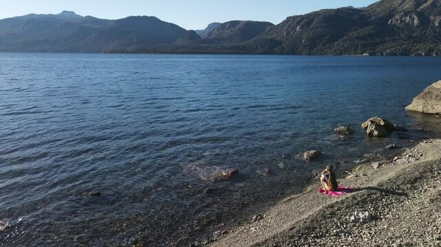 Aerial Drone Footage of Villa Traful, Patagonia, Argentina: Sunny Day with Turquoise Waters, Pines, and Rocks, Perfect for Social Media and Tourism Agencies