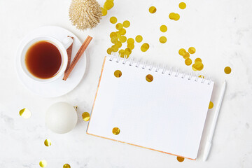 New Year's resolutions, coffee, and confetti create an exciting mock-up scene for a fresh start. Copy space.