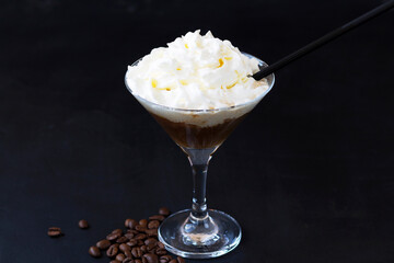 chocolate cream. coffee cocktail with whipped cream on dark background. Alcoholic or non-alcoholic cocktail with liqueur, whiskey, white cream. copy space.