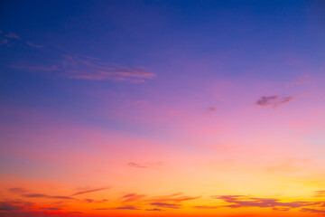 Colorful clouds and sky. Dusk and sunset. Evening clouds with orange, yellow, pink and red sunlight and amazing storm clouds in the dusk sky. 