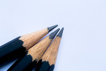Obraz premium Close-up of a black wooden pencil,The tip of a wooden pencil is seen close up