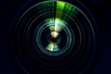 Close-up macro lens,Photo or video camera lens with light reflections close-up on the black background.