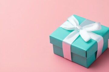 Turquoise Gift Box with White Ribbon on Pink Background - Perfect for Celebrations and Gifting Designs