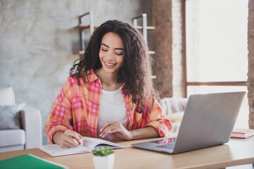 Photo of positive good mood woman dressed orange shirt online studying modern gadget indoors house apartment room