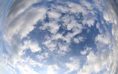 very wide sky photographed with a fisheye lens and clouds