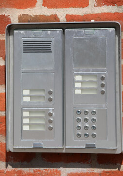 modern intercom with various bell buttons and a numeric keypad to dial the number of the apartment to call