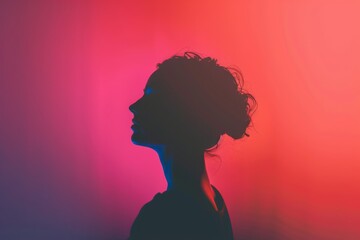 The silhouette of a woman in profile against a gradient background of red and blue.