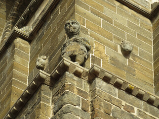 Cathedral of Puy-en-Velay. 12th century. France. Detail of the bell tower with corner figure and corbels © JOSEANTONIO