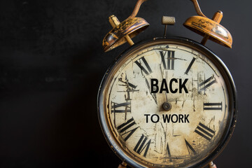 Clock, words "back to work" written on it. Deadline, reminder and motivation concept.