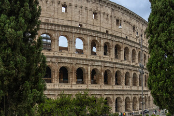 Roman Colosseum, the largest ancient amphitheatre ever built, Italy. Arches, exterior facade....