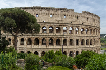 Roman Colosseum, the largest ancient amphitheatre ever built, Italy. Arches, exterior facade....