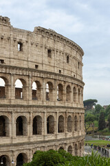 Fototapeta premium Roman Colosseum, the largest ancient amphitheatre ever built, Italy. Arches, exterior facade. Giardinetto del Monte Oppio. Rome, Italy