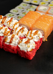 Set of sushi rolls on a black background