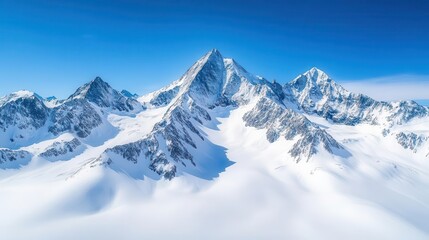 Obraz premium Snow-capped mountains under a clear blue sky, winter weather, cold and majestic