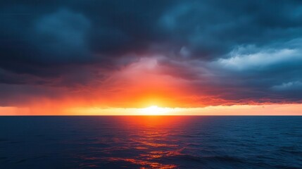 Fototapeta premium Sun setting behind a line of thunderstorms on the horizon, dramatic weather, contrast of light and dark