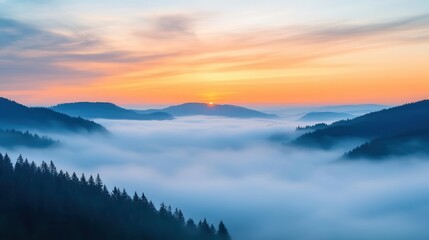 Sunrise breaking through morning fog over rolling hills, foggy weather, peaceful dawn