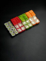 Set of sushi rolls on a black background