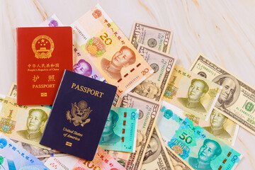 It symbolizes confrontation between economies of China, United States when authentic passports are presented with Chinese currency, yuan, US dollars banknotes various denominations.