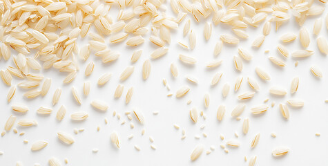Obraz premium Pockets of early rice grains scattered on a white background