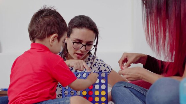 Mother playing with her son and aunt