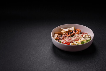 Delicious fresh caesar salad with salmon, lettuce, tomatoes and egg
