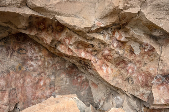 Ancient rock art at Cueva de Las Manos ( Cave of the Hands ) in Santa Cruz Province, Patagonia, Argentina. The art in the cave dates from 9,0001 to 13,000 years ago.
