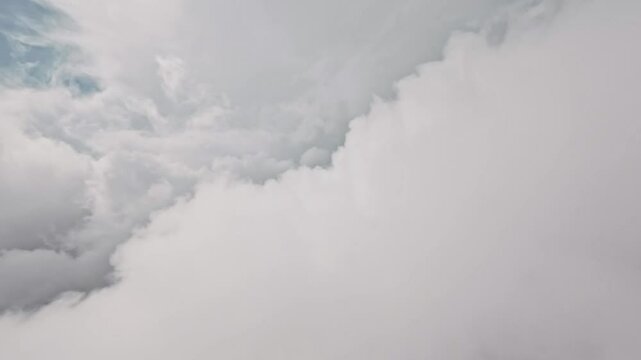 HD. Aerial video shooting. Flight in the clouds and the sun in the sky. Amazing flight through the clouds with beautiful light on an FPV drone