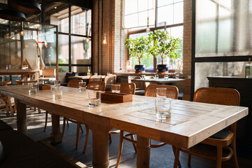 The aesthetic COZY appearance of an empty cafe with wooden furniture and minimalism.