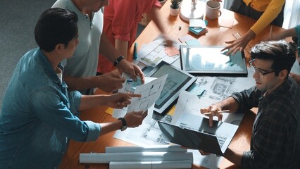Time lapse of civil engineer team working together to plans building construction. Top view of architect designer walking and joining meeting while talking idea while looking at tablet. Symposium.